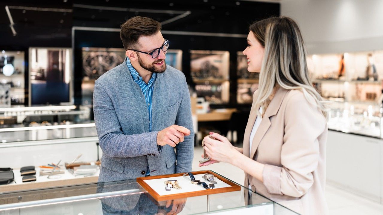 Client advisor and customer in a luxury retail store