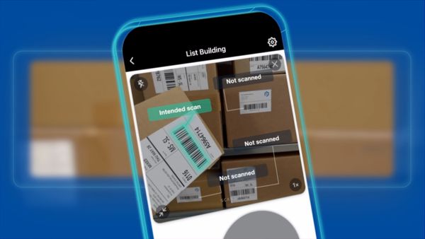 Smartphone displaying a "List Building" barcode scanning app, scanning shipping labels on boxes with "Intended scan" and "Not scanned" labels.